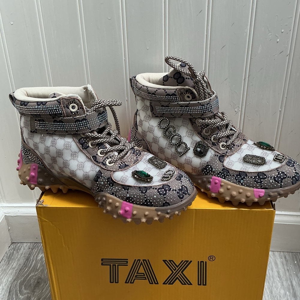 Taxi brand casual sneakers featuring a rhinestone-embellished monogram pattern